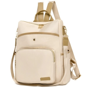 Detail view of cream nylon backpack with khaki PU trim and multi-pocket design structure