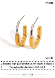 Detailed view of U-shaped dual-tone earrings with high polish and real gold PVD plating