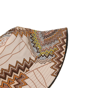 Macro detail of bohemian geometric pattern stitching on the cotton sun bucket hat