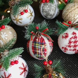Linen Christmas balls with pine needles, cones and berries for festive tree decoration
