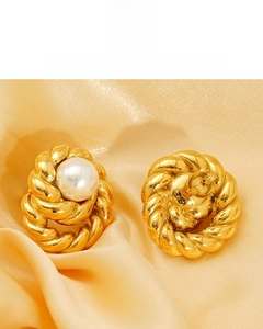 Detail of 18K gold plated pearl stud earrings with twisted rope texture on silk