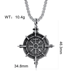 Macro shot of vintage silver Viking compass pendant with detailed size measurements