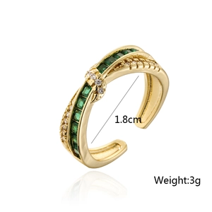Detail of 18K gold plated ring with green square zircons showing 1.8cm diameter
