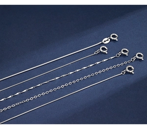 Detailed view of five S925 sterling silver chain styles on navy velvet background