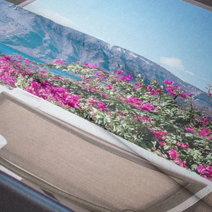 Close-up of polyester tapestry showing detailed mountain and floral landscape texture