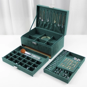 Three-layer green velvet jewelry box with metal lock and multi-compartment storage