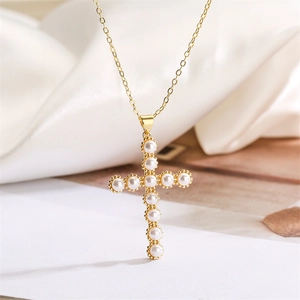 Elegant gold cross necklace with white pearls inlay for a luxury minimalist jewelry look
