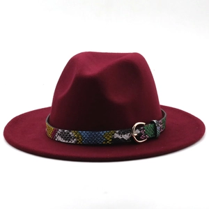Close-up of wine red fedora hat with a snakeskin pattern band and gold metal buckle