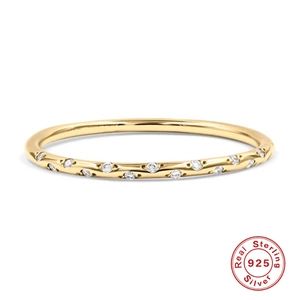 Detailed view of gold plated 925 silver ring featuring shimmering round cut cubic zirconia