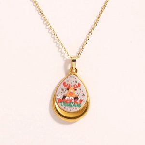 Golden teardrop pendant necklace featuring a colorful reindeer and Merry Christmas motif
