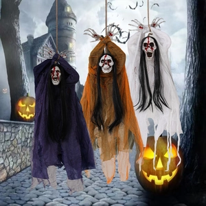 Three hanging Halloween ghosts with skeletal bloody faces in purple orange and white fabric