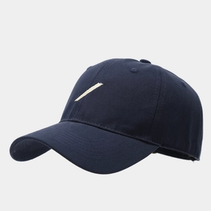Detailed side view of navy cotton baseball cap with minimalist white stripe embroidery