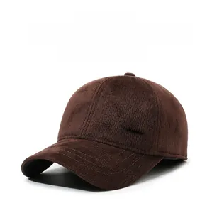Detail of winter wool baseball cap featuring corduroy texture and fashion metal logo