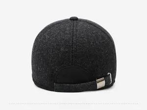 Detail of adjustable metal buckle and neat stitching on dark wool blend baseball cap