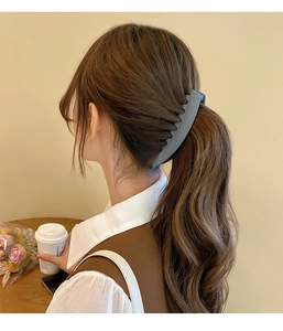 Blue matte banana hair clip holding high ponytail for women, back view fashion accessory