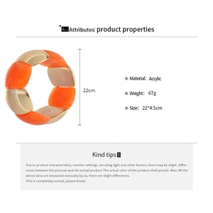 Detail of chunky orange acrylic and gold metal bracelet pieces with 22cm elastic band