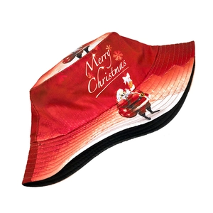 Red reversible Christmas bucket hat with Merry Christmas print and Santa Claus design