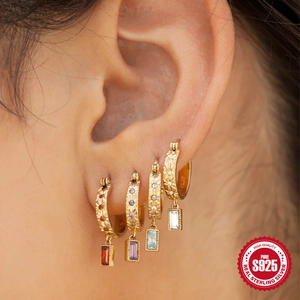 S925 silver gold earrings set with colorful rectangular zircons worn on model ear