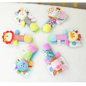 Set of six plush animal baby rattles including lion and elephant on soft white background