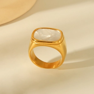 Minimalist 18K gold square shell ring with white marble texture on beige background