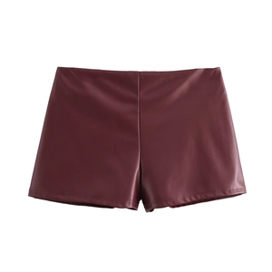 Women's burgundy PU leather sleeveless top and shorts set in minimalist flat lay style