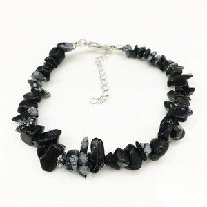 Detail of snowflake obsidian fragment bracelet with silver lobster clasp and extension