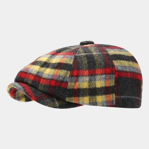 Close-up of vintage red and yellow plaid newsboy cap with wool texture and short brim