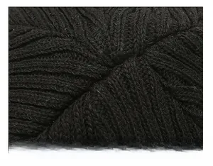 Close-up of the professional stitching and knit texture on the top of this black beanie