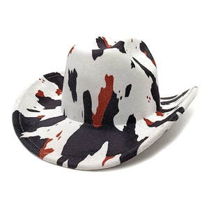 Detail of western cowboy hat with cow print pattern and thick felt material