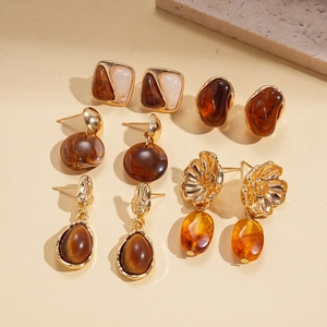 Ten-piece vintage resin drop flower earring set in amber brown and gold tones