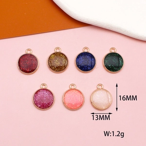 Close-up of colorful glitter heart and star resin charms with rose gold metal frames