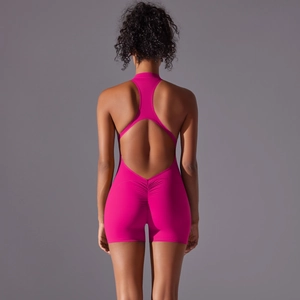 Detail of rose pink yoga bodysuit with racerback cutout and scrunch butt design
