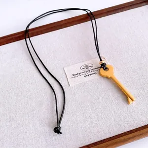 Vintage gold key pendant on black leather cord necklace for women daily fashion