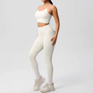 Detailed side view of cream white seamless yoga set featuring sports bra and high waist leggings