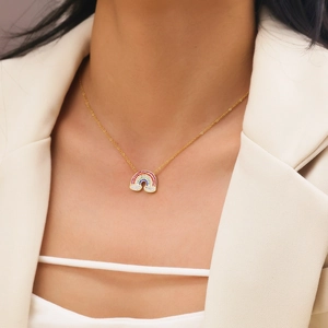 18k gold plated stainless steel necklace with a rainbow zircon pendant on a model