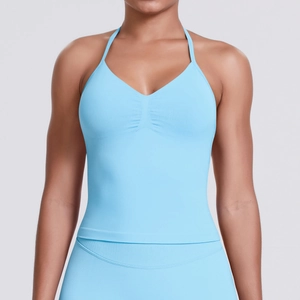 Detail of light blue halter yoga top with pleated chest design and high elasticity fabric