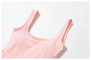Detail of light pink u-neck sports dress with wide straps and smooth seamless stitching