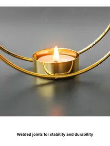 Close-up of golden iron circle candle holder with secure electric welding detail