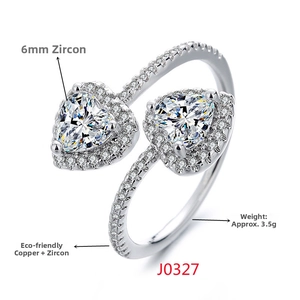 Detail view of double heart zircon ring with 6mm stones and pave setting on band