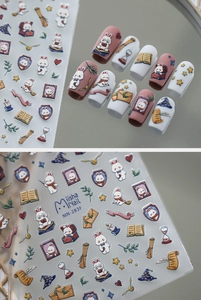Detail of magic rabbit nail stickers with wizard hats and scrolls on a glossy surface