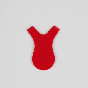 Detail view of red Y-shaped lash lift tool with comb side and anti-slip ridges