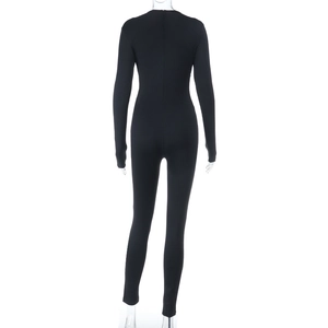 Detail of black long sleeve jumpsuit featuring back hidden zipper and slim fit design