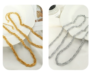 Detailed comparison of thick intertwined gold and silver necklaces with twisted textures