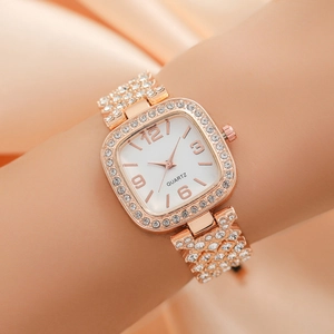 Fashionable rose gold square quartz watch with rhinestone detailing on wrist