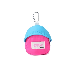 Detail view of hat-shaped mini storage bag with blue top, pink base and metal carabiner