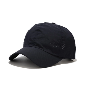 Close-up of laser-cut ventilation holes on navy blue quick-dry athletic mesh sun cap