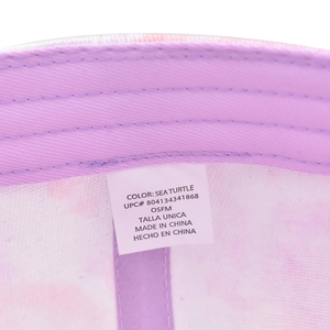 Detail view of purple tie-dye baseball cap interior with sweatband and wash label
