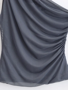 Detail view of charcoal grey ruched mesh fabric showing light texture and draped structure