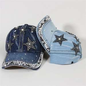 Detail of sparkling rhinestone star and sequin edge on denim baseball caps