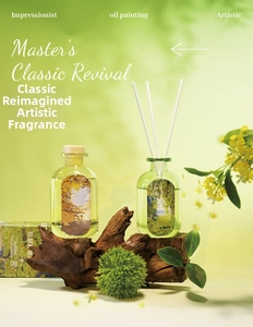 Artistic reed diffuser bottles with Impressionist labels on a natural wood base